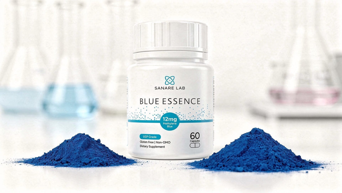 Sanare Lab “Blue Essence” supplement bottle on a white lab surface with two piles of blue powder and blurred laboratory glassware in the background.